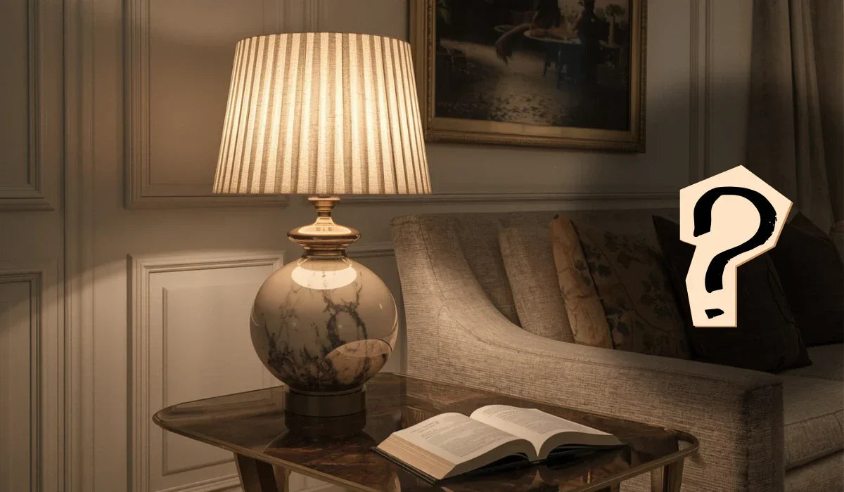Featured image for top questions about table lamps showing a stylish living room table lamp with a question mark graphic.