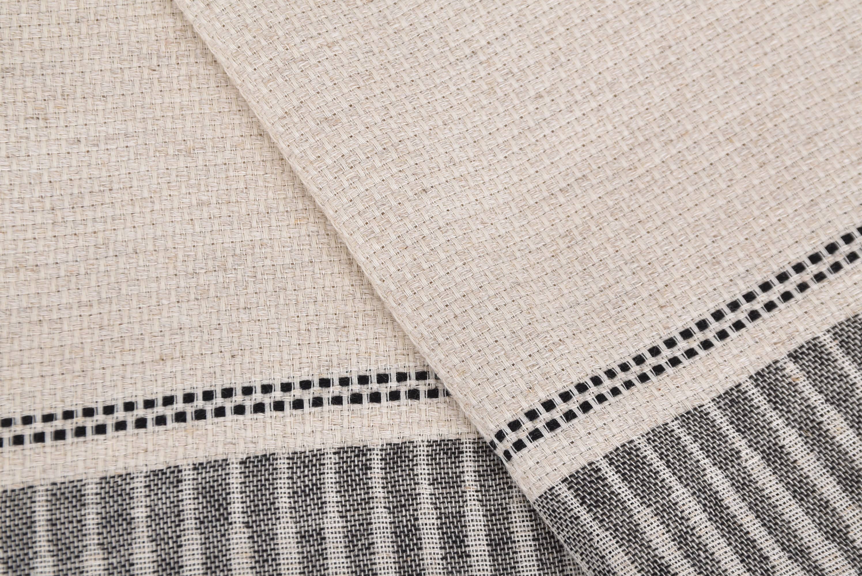 Close-up of beige fabric with black and white striped pattern