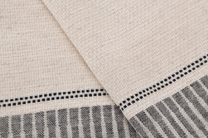 Close-up of beige fabric with black and white striped pattern