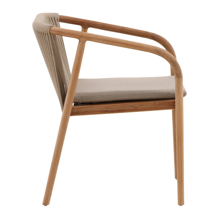 Side view of wooden armchair with cord-woven back and taupe seat cushion, minimalist dining chair isolated on white background