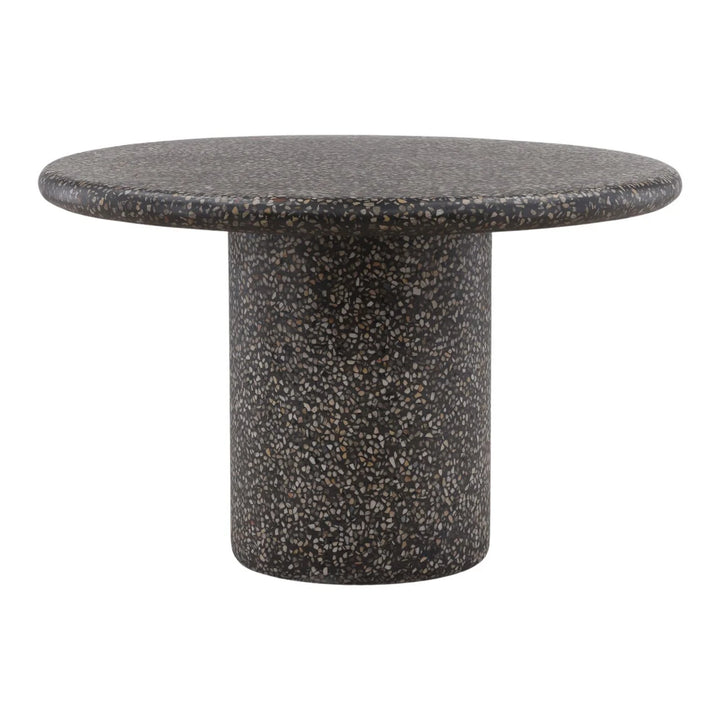Black terrazzo round side table with pedestal base and speckled stone finish, isolated on white background