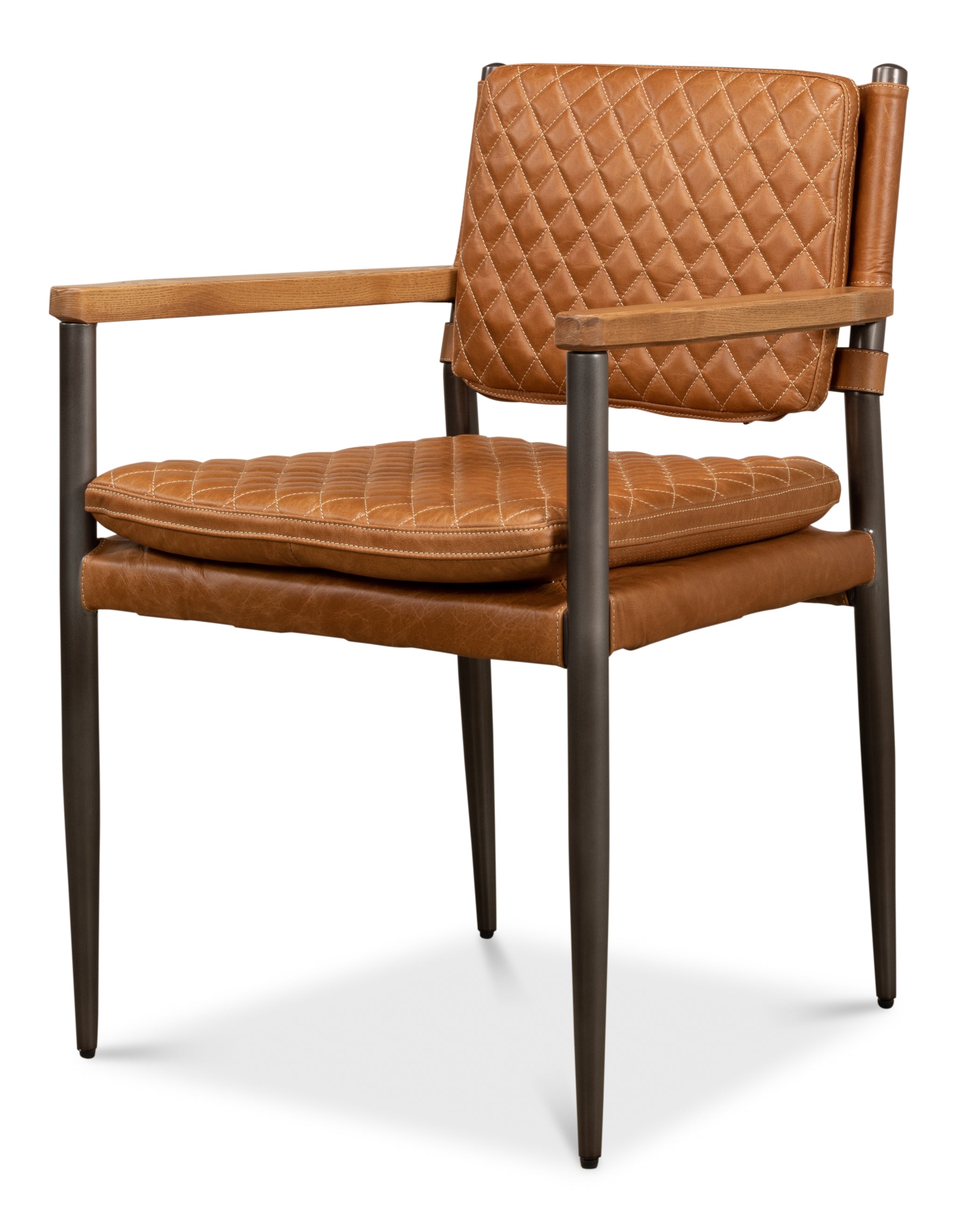 A brown Harley leather chair with quilted backrest, wooden arms, and a metal frame.