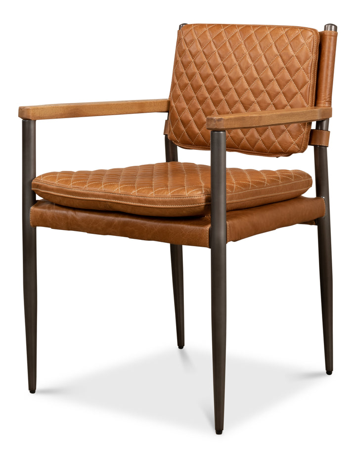 A brown Harley leather chair with quilted backrest, wooden arms, and a metal frame.