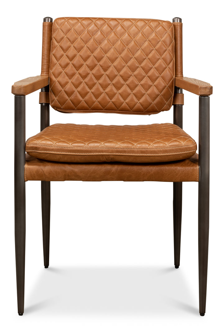 Brown quilted leather dining chair with upholstered seat and back, dark wood legs, and slim armrests isolated on white background
