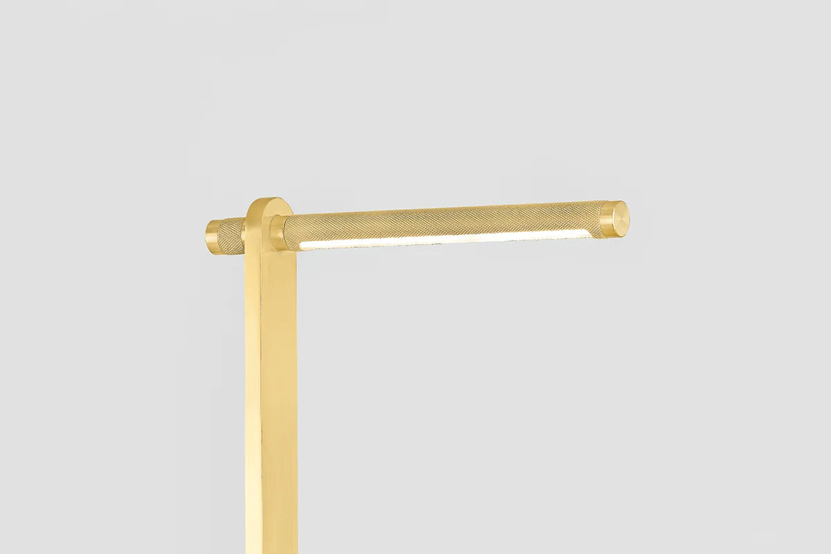 Deptford Floor Lamp: Sleek gold metal construction, geometric shade with knurling details.