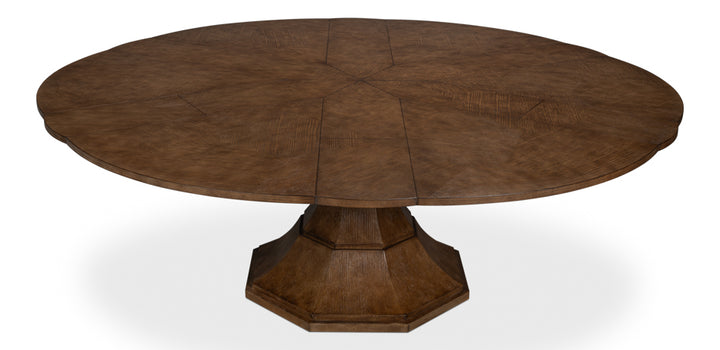 Closed view of the Gisele Jute Expanding Dining Table showing the elegant herringbone marquetry top and sculptural octagonal base.