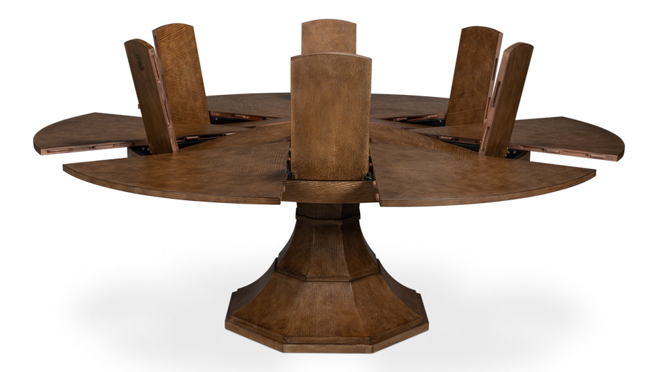 Round wooden pedestal dining table with built-in extension leaves lifted open, showing the hidden leaf storage and expanding tabletop mechanism
