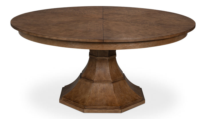 Round wooden dining table with pedestal base and rich brown finish, classic farmhouse style table isolated on white background