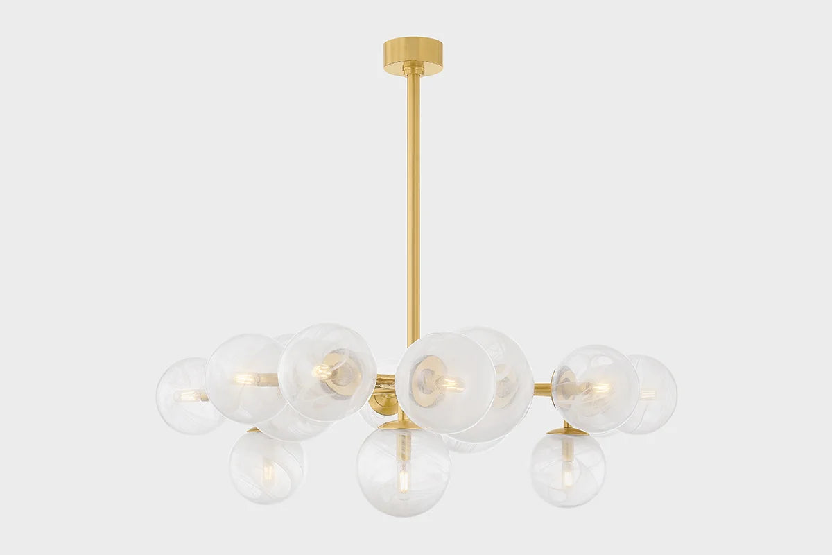 A modern chandelier with a gold branch-inspired frame and clear swirled glass globes, against a white background.