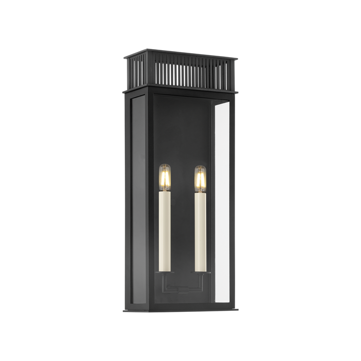 A vintage-inspired outdoor wall light with a clear glass shade and a vented roof, in a textured black finish.
