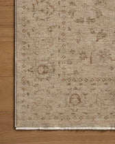 Beige patterned rug on a wooden floor