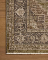 Decorative rug with intricate patterns on a wooden floor