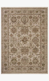 Decorative rug with intricate patterns in beige and brown tones on a plain background