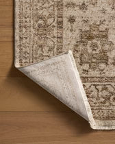 Close-up of a patterned rug on a wooden floor