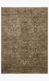 Patterned rug with intricate designs on a plain background