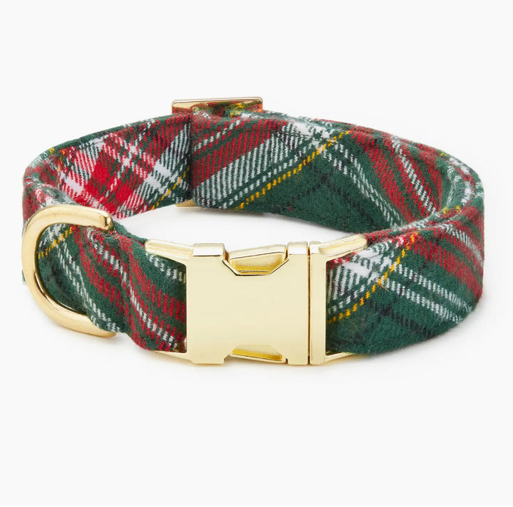 Stylish green and red plaid dog collar with a gold buckle, perfect for adding flair to your pet's accessories.
