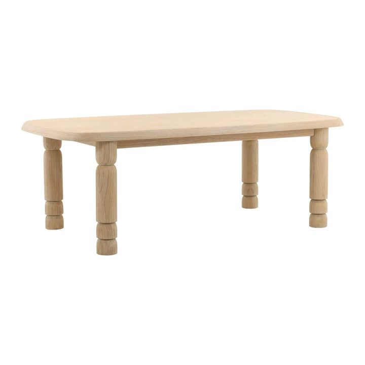 Light wood coffee table with rounded rectangular top and turned legs, minimalist design isolated on white background