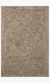 Beige area rug with intricate patterns on a plain background