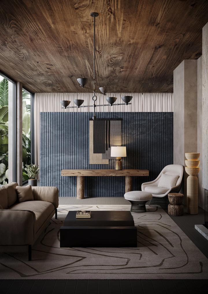 Modern rustic living room with wood ceiling, pendant lights, textured wall paneling, and neutral furniture