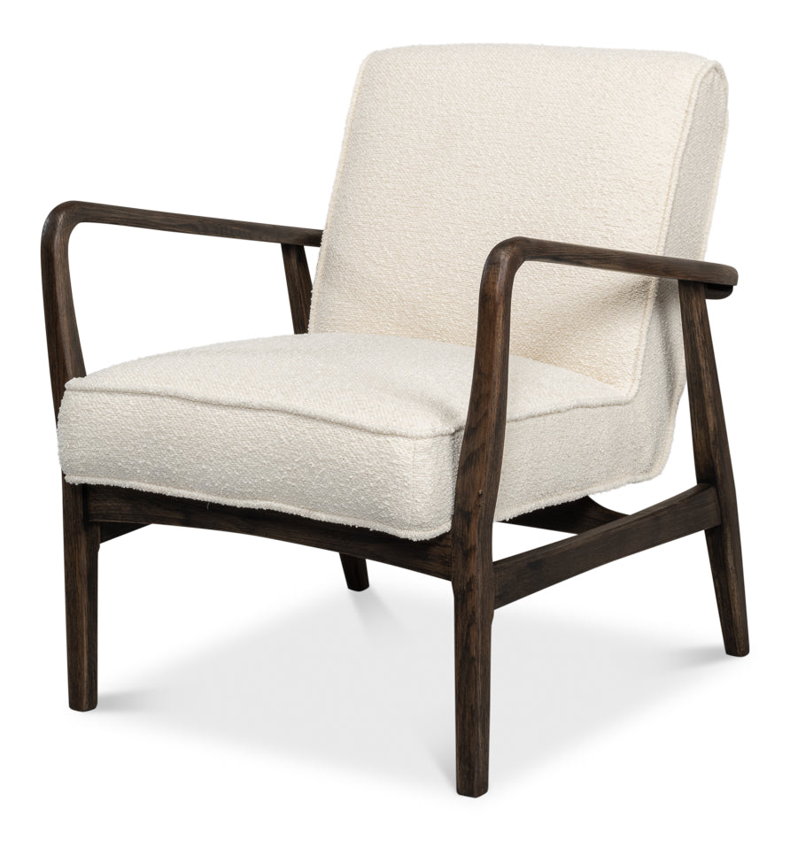 Ivory boucle accent chair with dark wood frame and angled arms, mid-century modern lounge chair isolated on white background