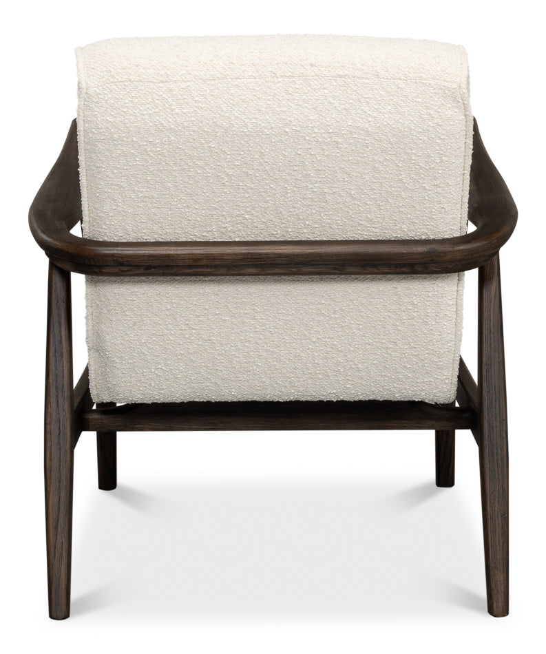 Back view of ivory boucle lounge chair with curved dark wood arms and sturdy frame, accent chair isolated on white background