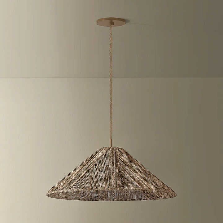 Woven pendant light hanging against a plain wall