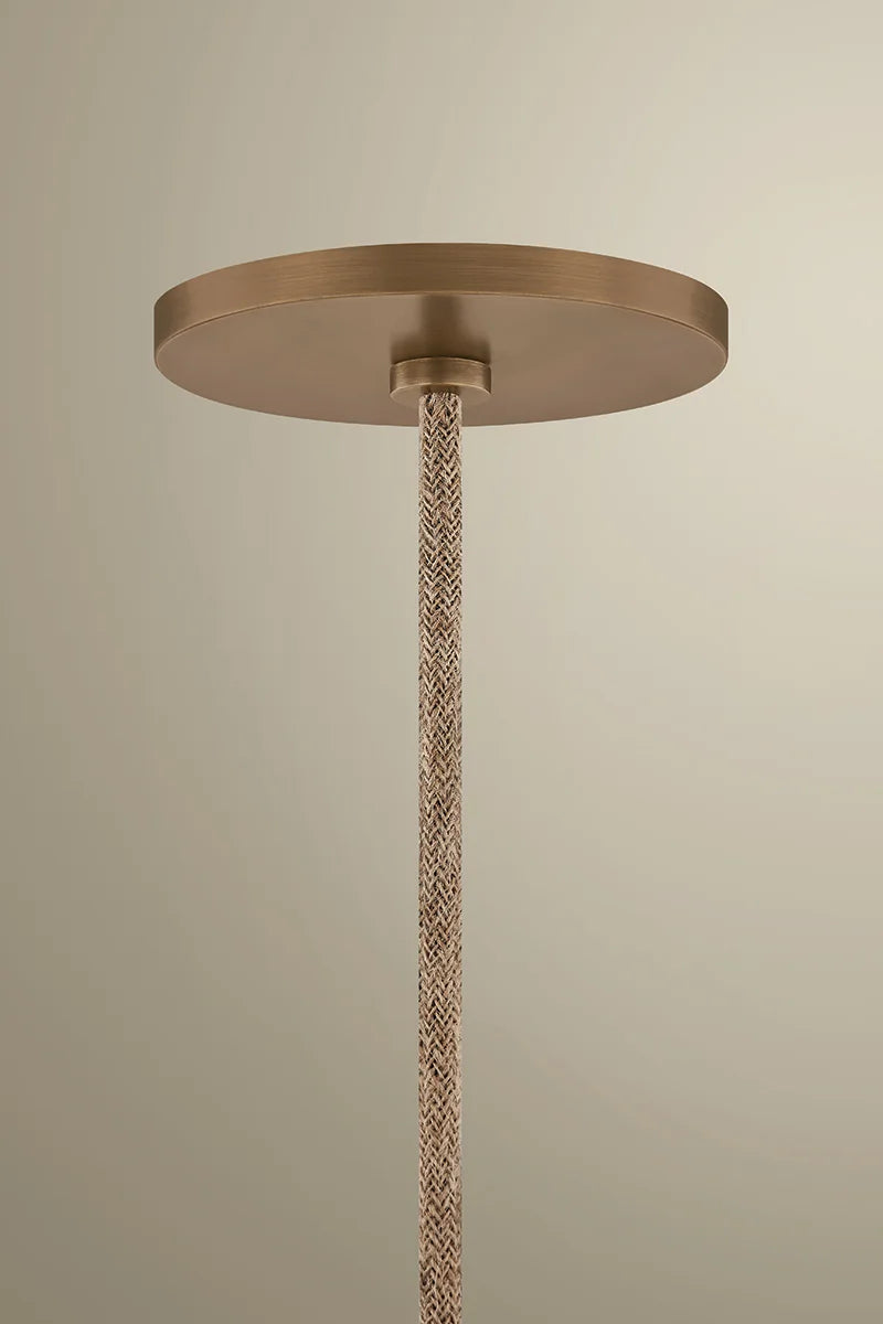 Bronze ceiling rose with braided cable against a beige background