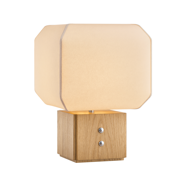Table lamp with beige fabric shade and wooden base on a white background