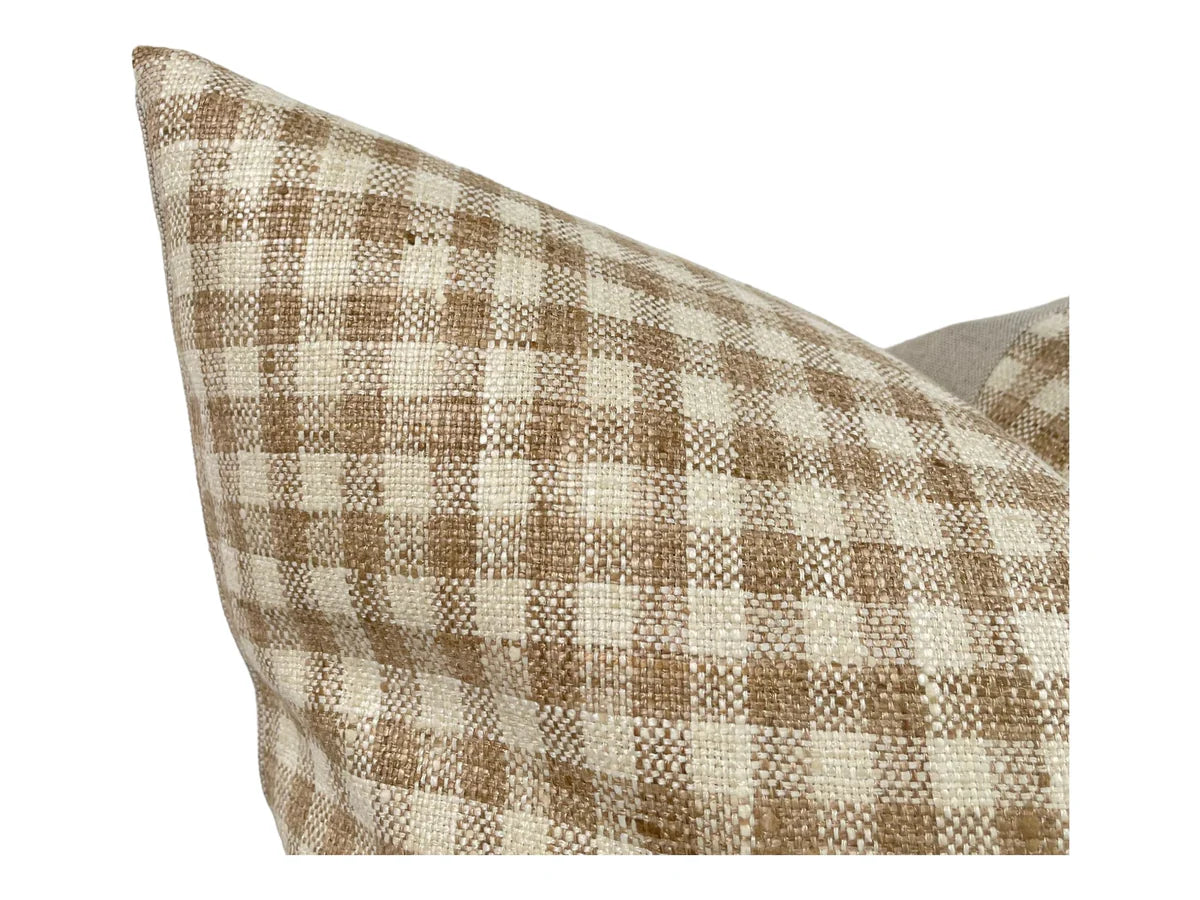 Plaid patterned pillow on a white background
