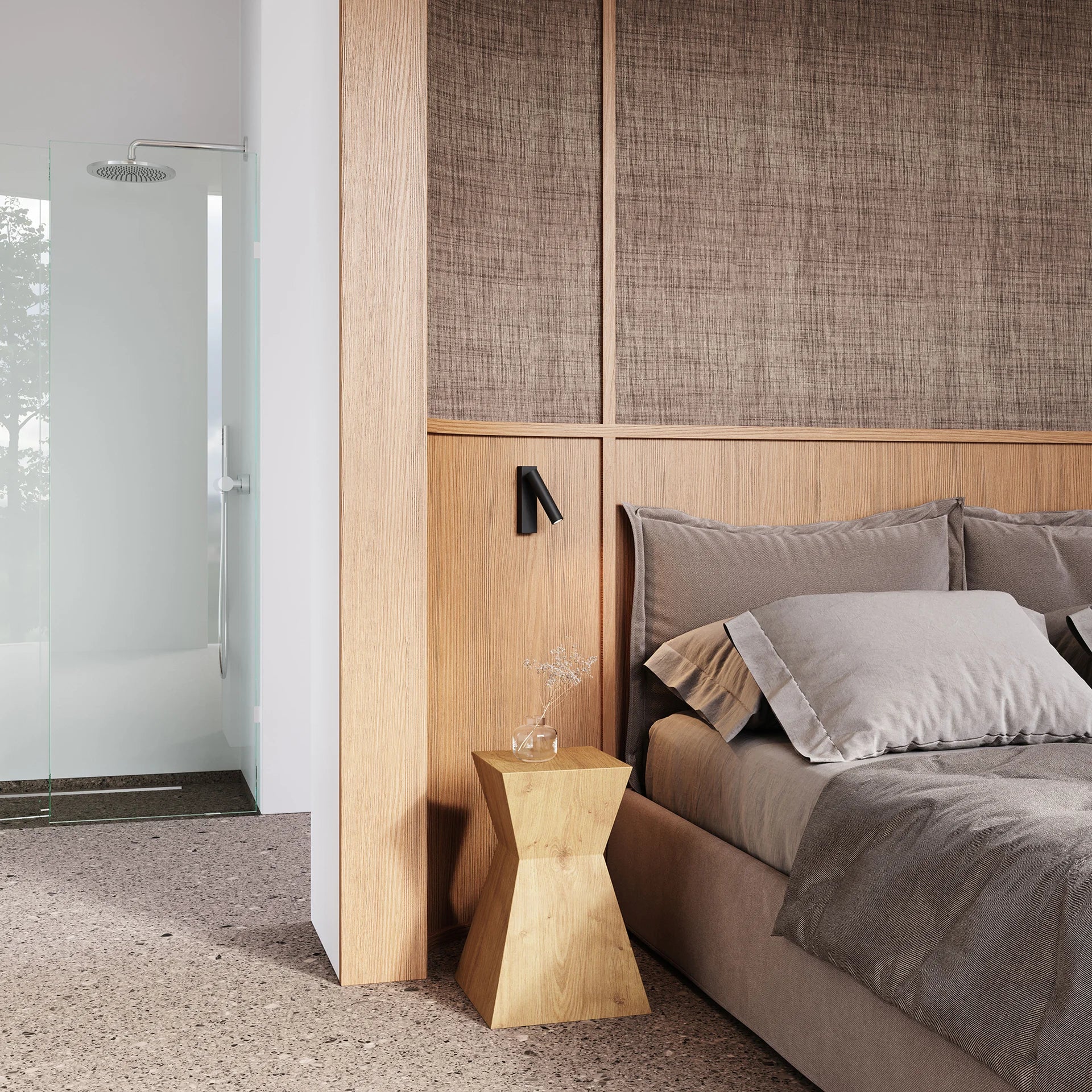 Modern bedroom with wooden side table and bed with gray bedding.