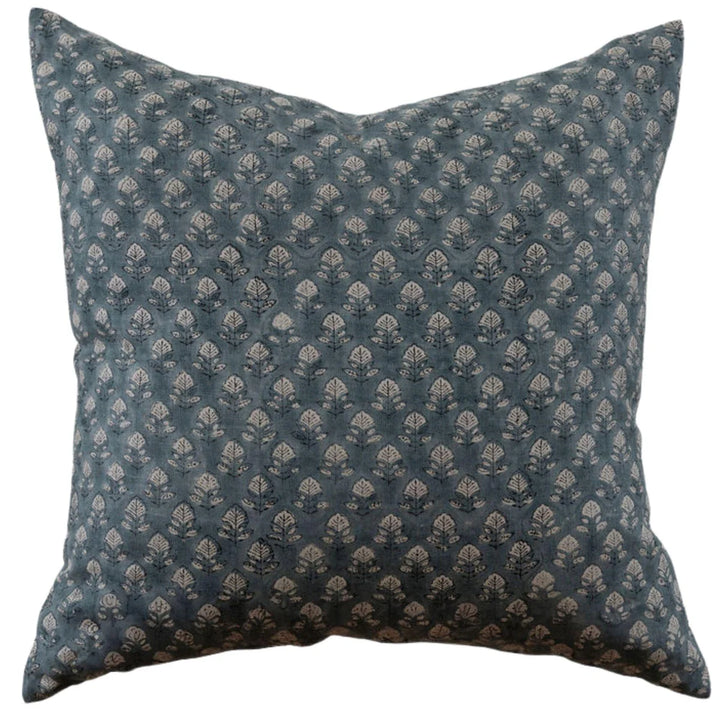 Decorative pillow with a blue and white pattern on a white background