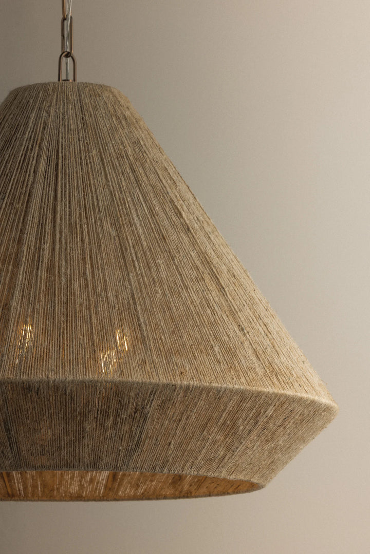 Textured pendant light fixture on a neutral background