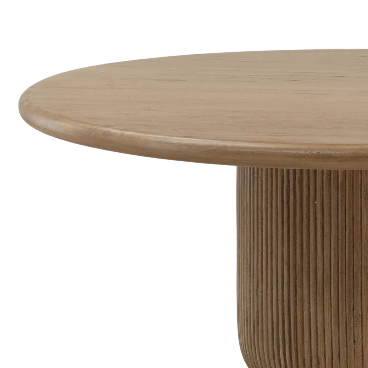 Close up of round wood dining table with smooth edge and fluted pedestal base detail