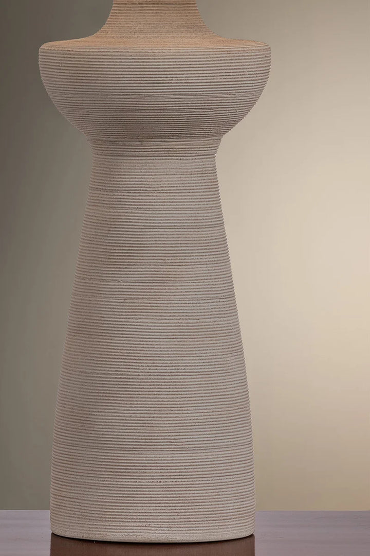 Textured dress form against a gradient background