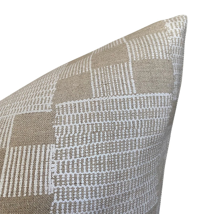 Textured checkered pillow with a geometric pattern on a white background