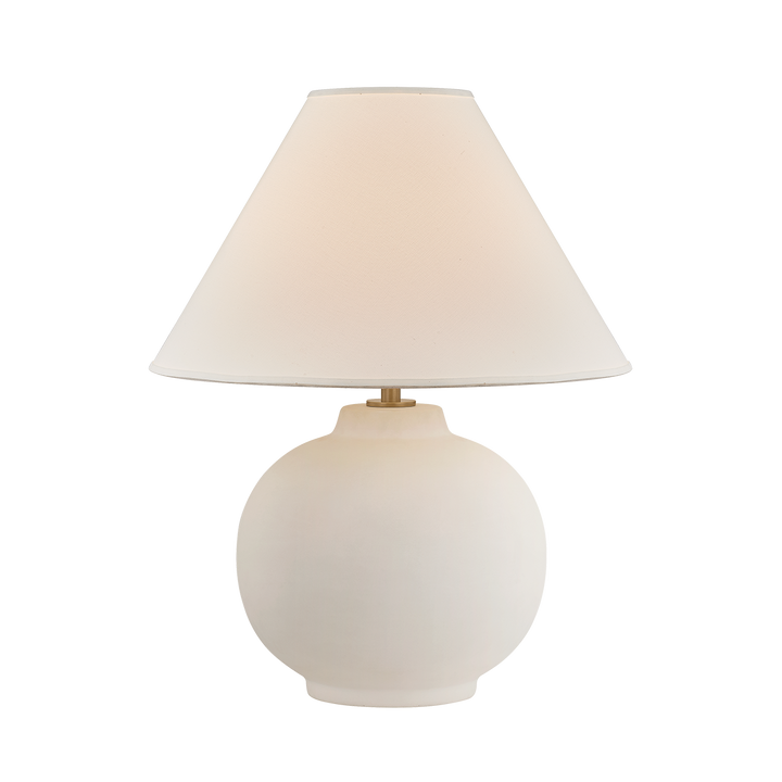 Beige table lamp with a white shade on a white background