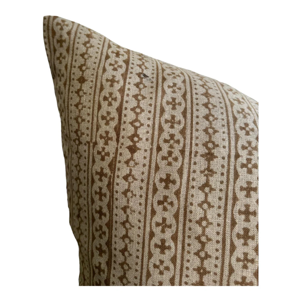 Decorative pillow with brown and beige pattern on a white background